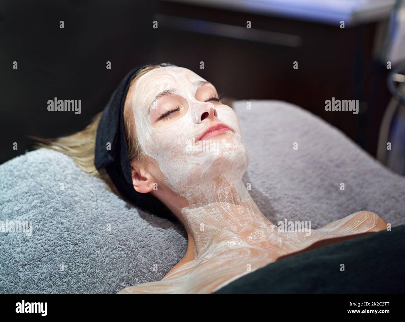 A young woman getting a facial at a spa Stock Photo Alamy