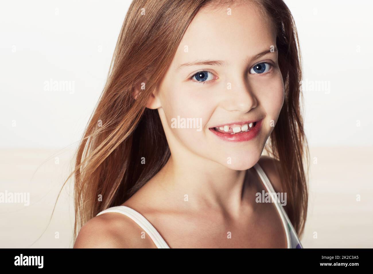 Sweet and innocent. Cropped portrait of a cute little girl smiling. Stock Photo
