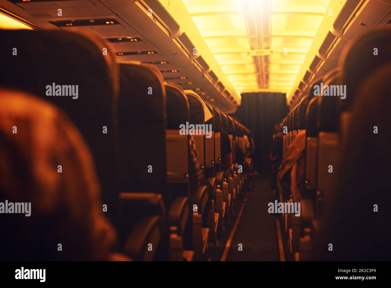 Time to jet off and explore the world. Shot of passenger seating inside an airplane. Stock Photo