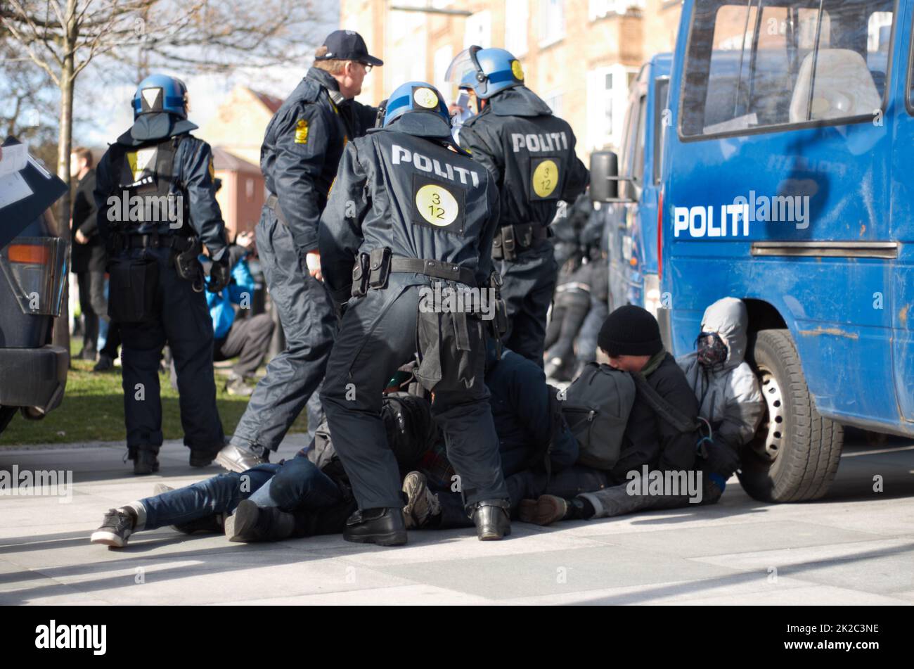 Enforcing the law. Policement arresting a suspect. Stock Photo