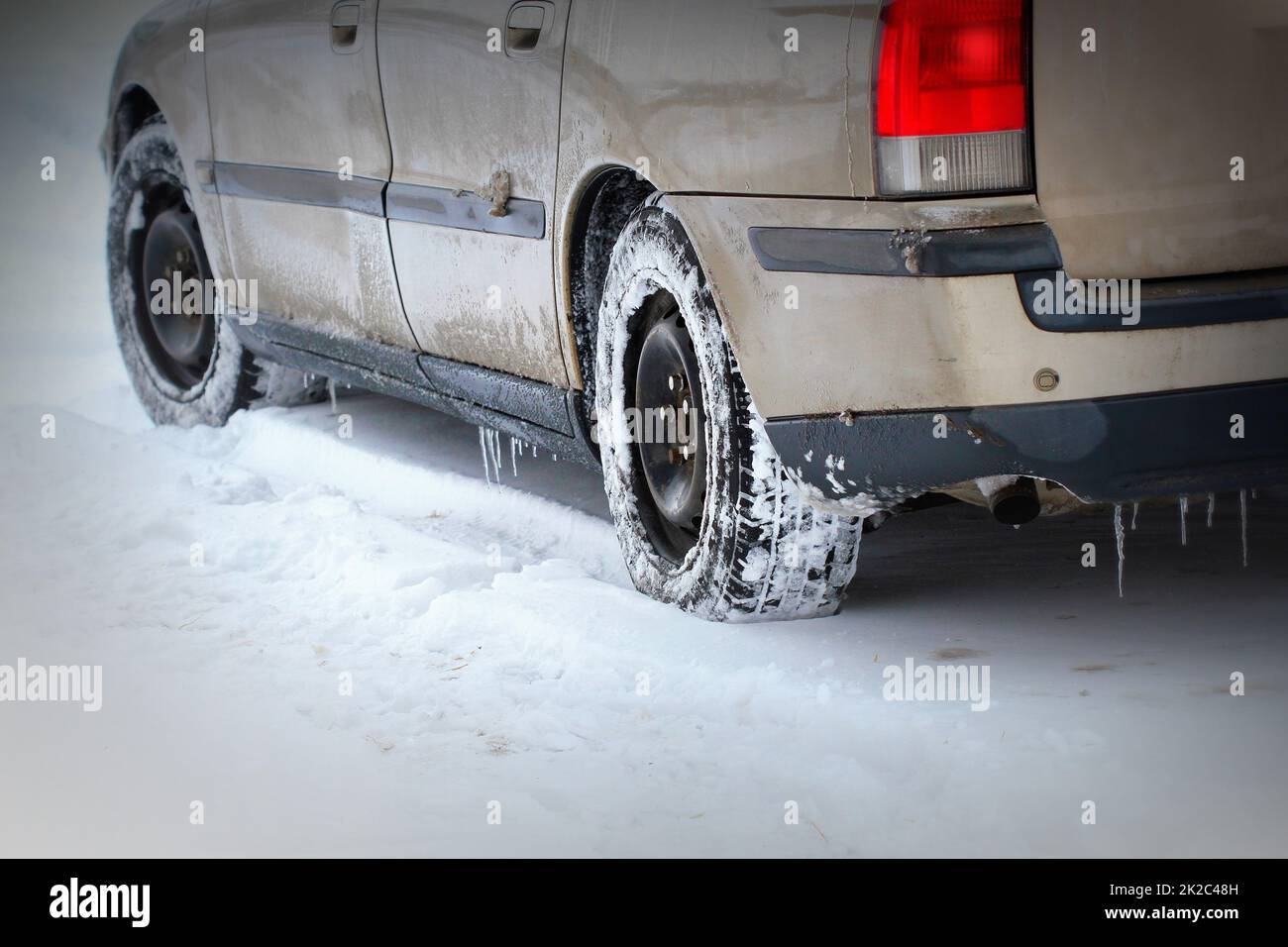 Closeup of car tires in winter on the road covered with snow Stock ...