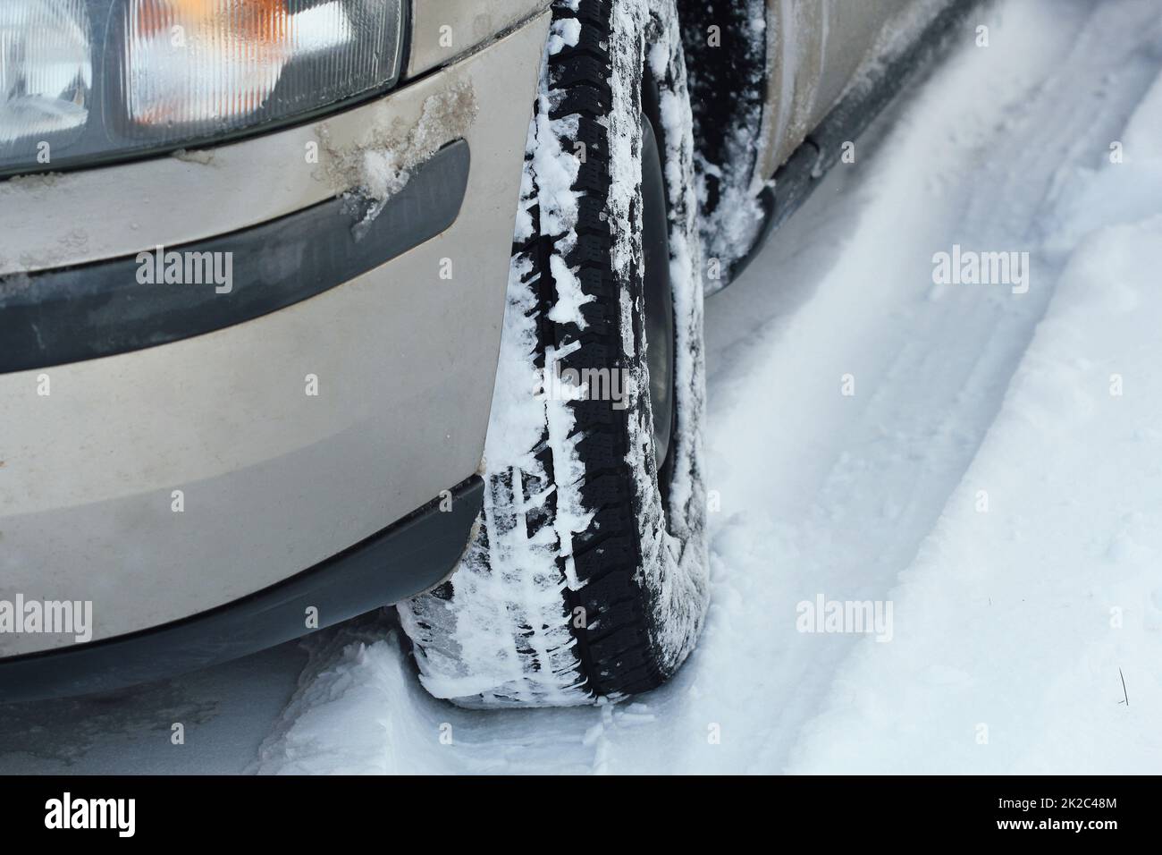 Closeup of car tires in winter on the road covered with snow Stock ...