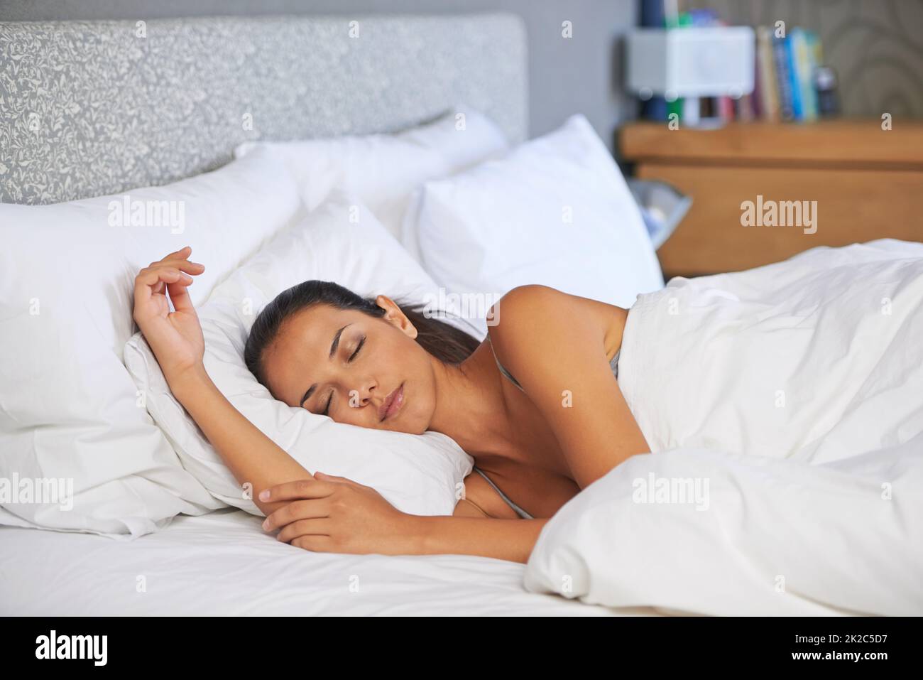 Shes out for a count. Attractive young woman catching up on some much needed sleep. Stock Photo