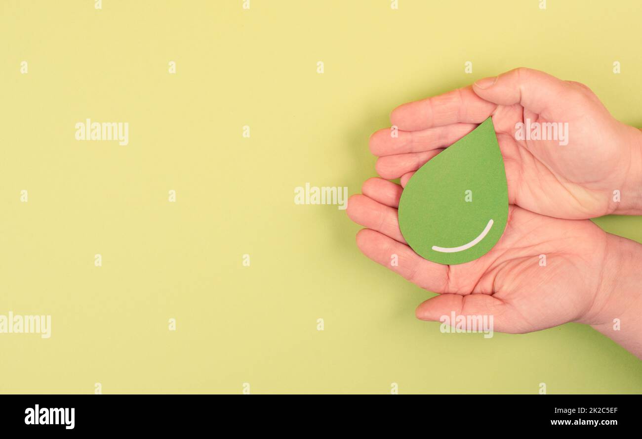 Holding a green drop, olive oil, alternative bio fuel, recycling