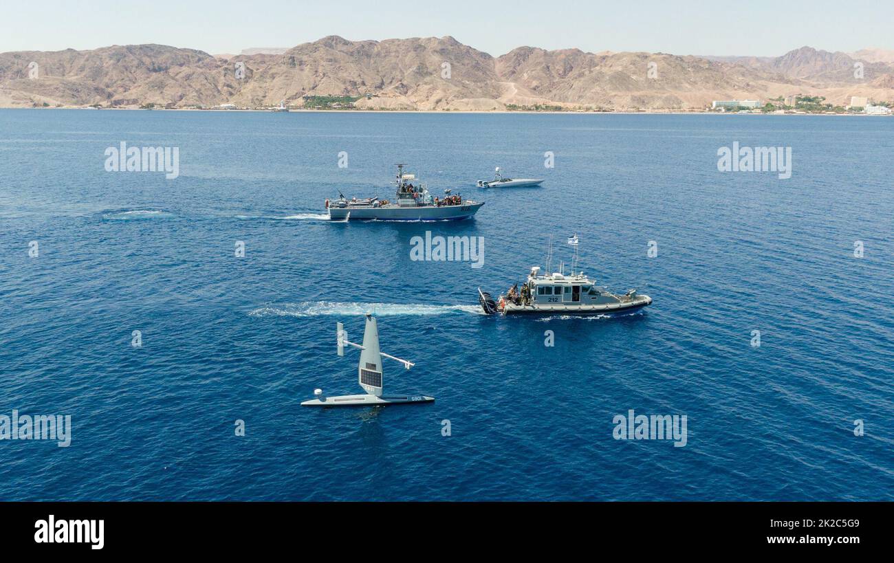 220921-N-NO146-1002 GULF OF AQABA (Sept. 21, 2022) Vessels from the Israeli Navy and U.S. Naval Forces Central Command operate in the Gulf of Aqaba with two unmanned surface vessels, a Devil Ray T-38, top, and Saildrone Explorer, bottom, during exercise Digital Shield, Sept. 21. Digital Shield is a bilateral training exercise between U.S. Naval Forces Central Command and Israeli naval forces that focuses on enhancing maritime awareness using unmanned systems and artificial intelligence in support of vessel boarding operations. (Courtesy Photo) Stock Photo