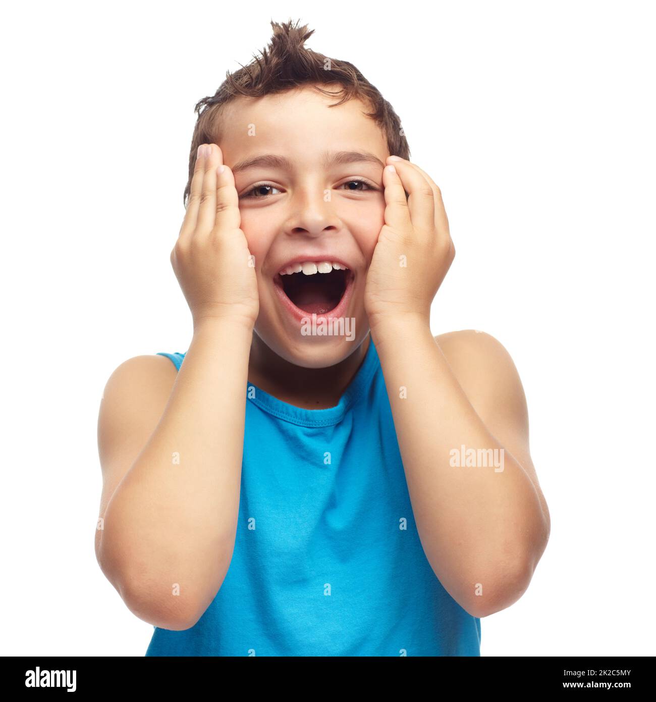 Wow, what a surprise. Portrait of a young boy looking surprised. Stock Photo