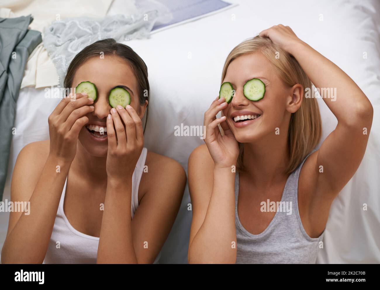 Beauty routines are always fun with my best friend. Two young women pampering themselves at a sleepover. Stock Photo
