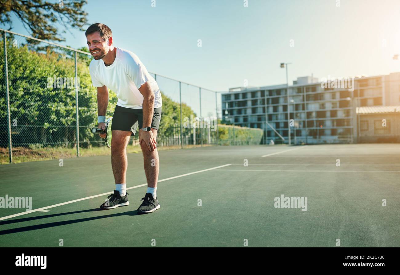 The sprinting, stopping and pivoting nature of tennis can cause injuries. Shot of a sporty young