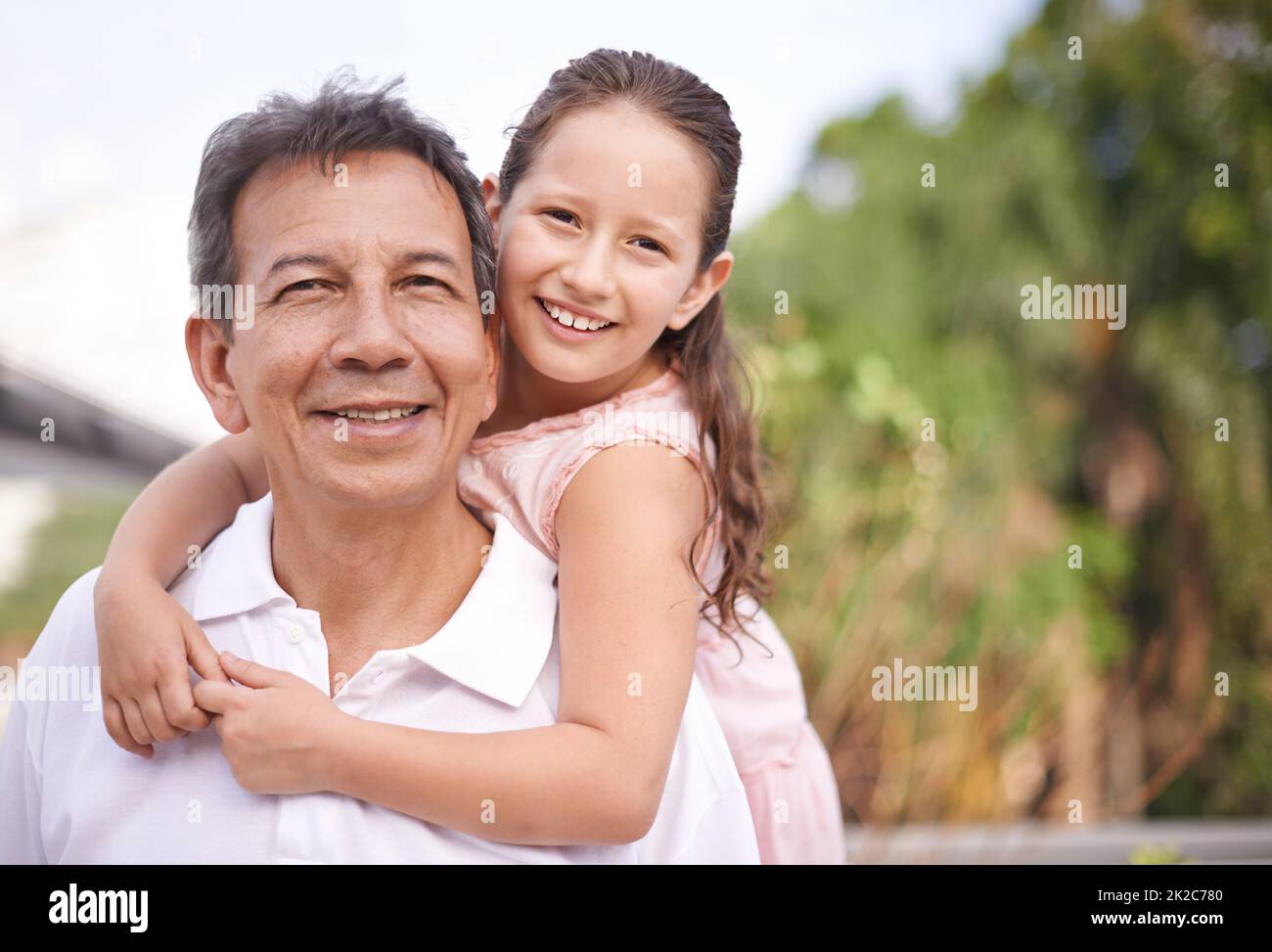 Enjoying time with granddad. Portrait of a young girl and her grandfather spending time together. Stock Photo
