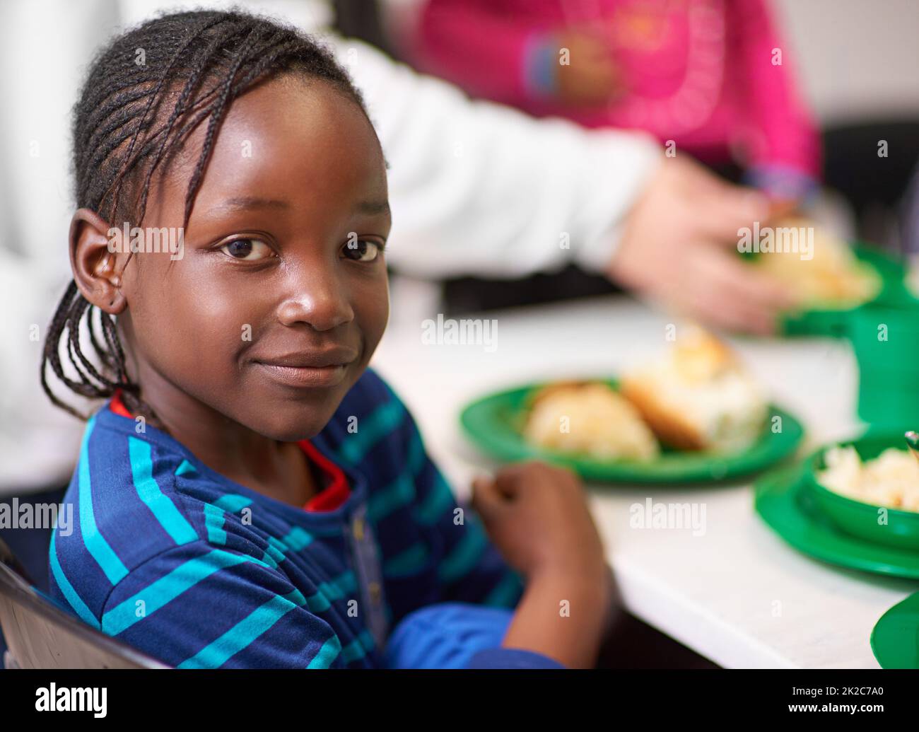 No child should be hungry. Portrait of a little girl sitting at a
