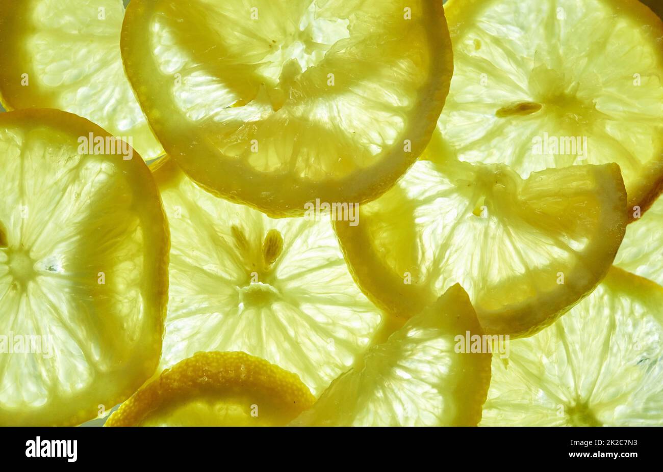 A bit of zest will get you feeling your best. Shot of a group of freshly cut lemon slices. Stock Photo