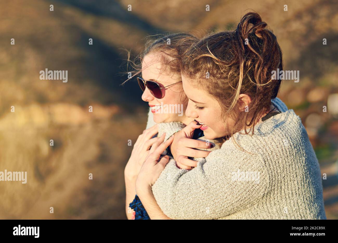 Friends forever. Cropped shot of a teenage girl embracing her best friend outdoors. Stock Photo