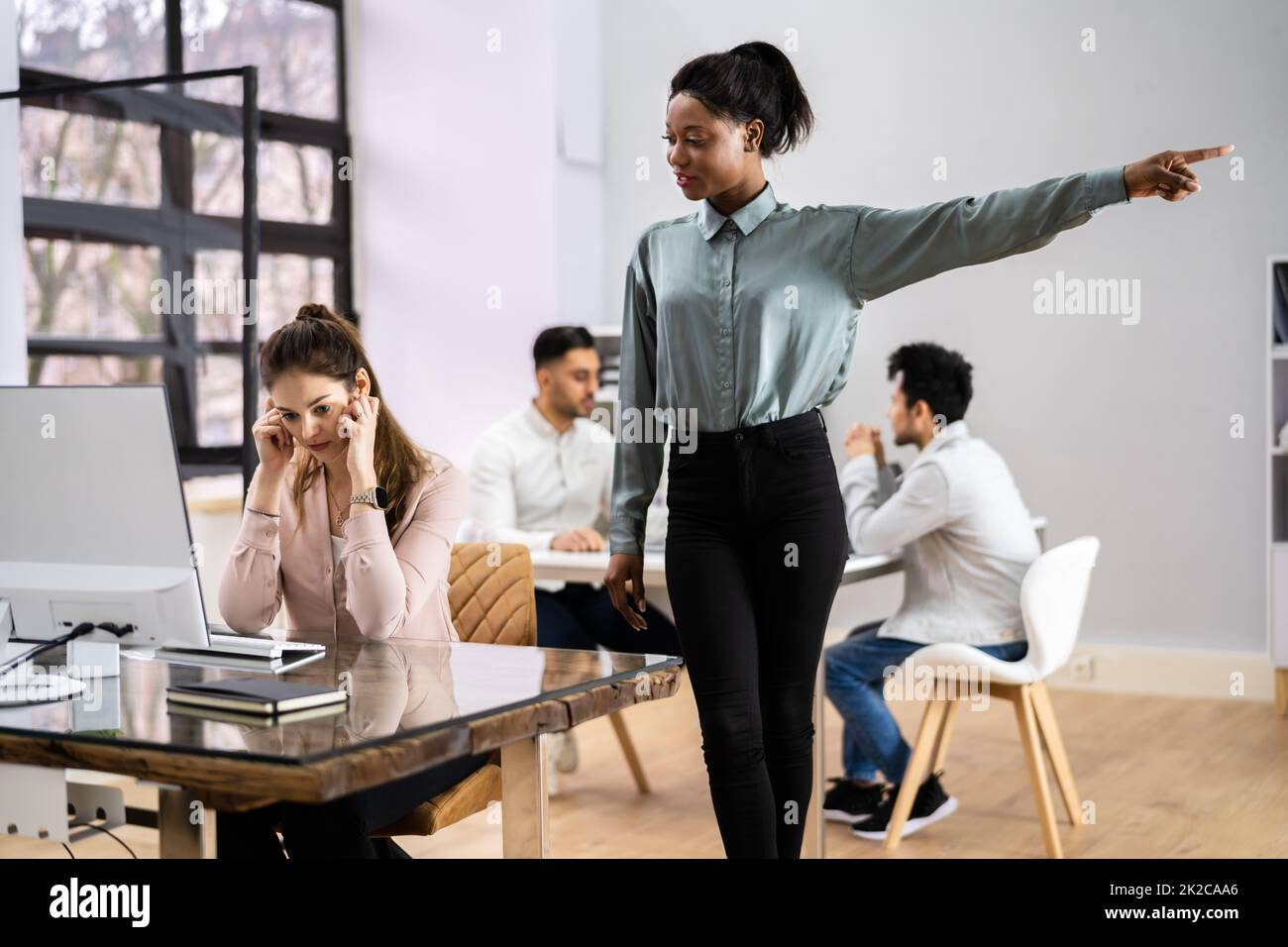Boss Firing Female Employee Stock Photo