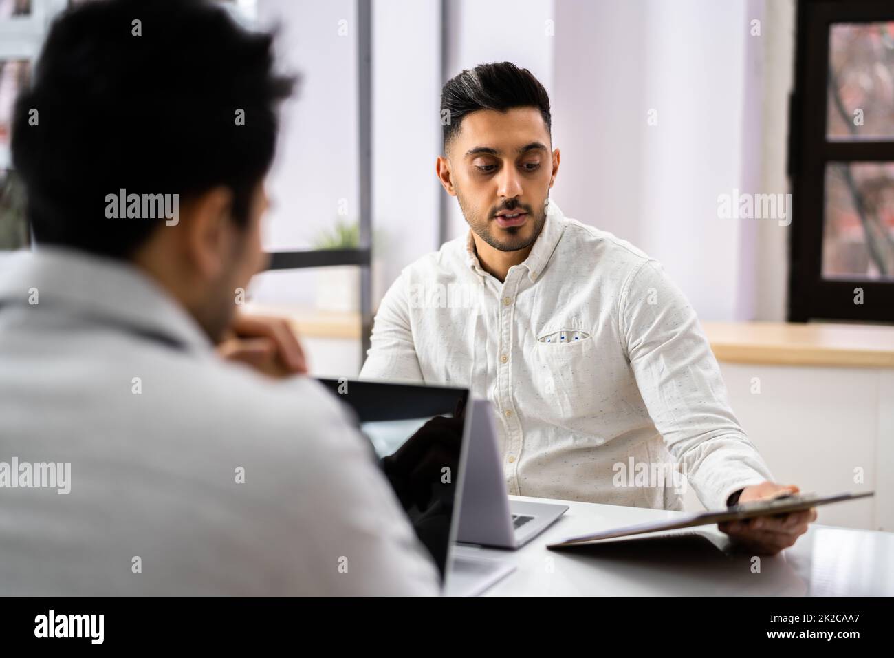 Businessman Conducting An Employment Interview Stock Photo