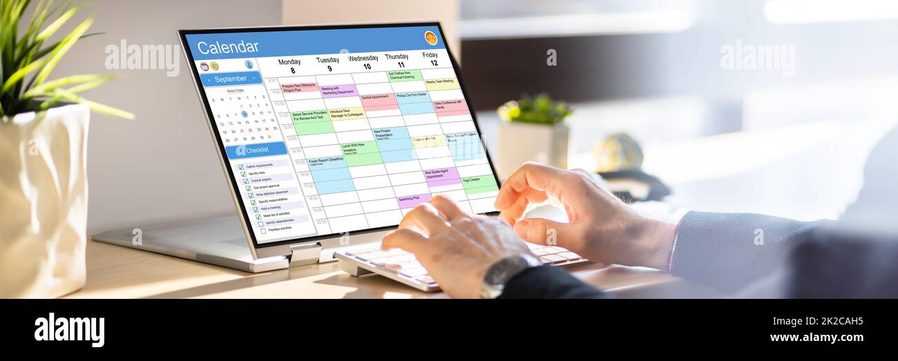 Executive Arranging Week Agenda In Calendar Stock Photo - Alamy