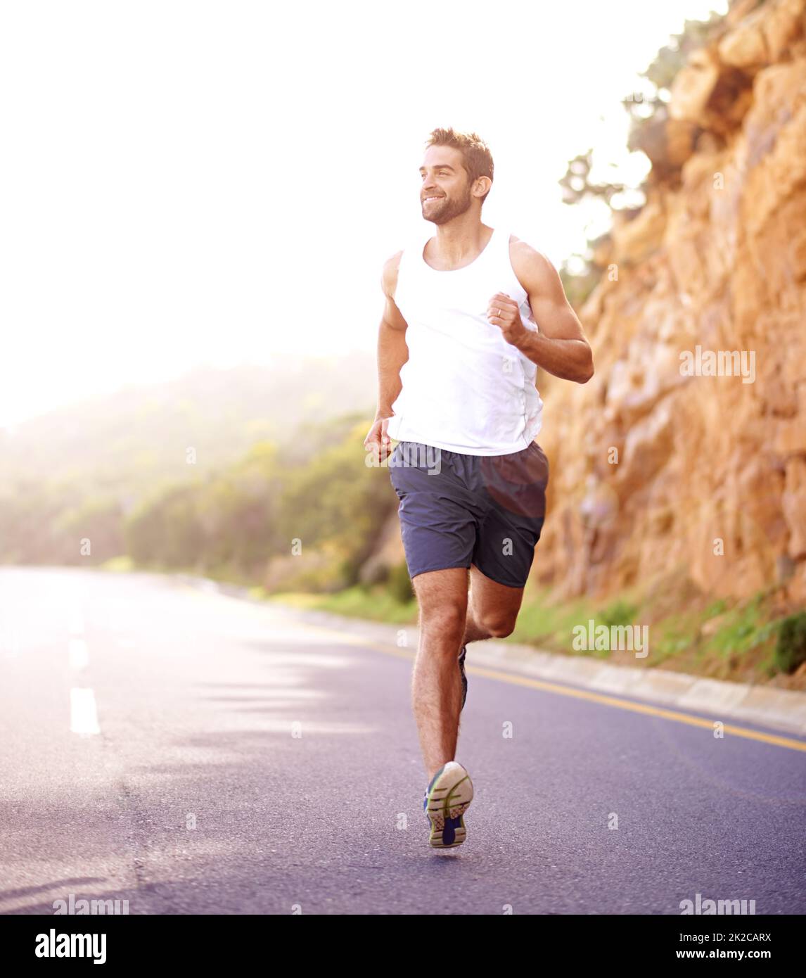 Plodding down the road of fitness. Full length shot of a handsome young