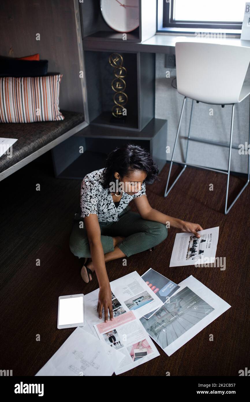 Designer planning work by cubicle Stock Photo Alamy