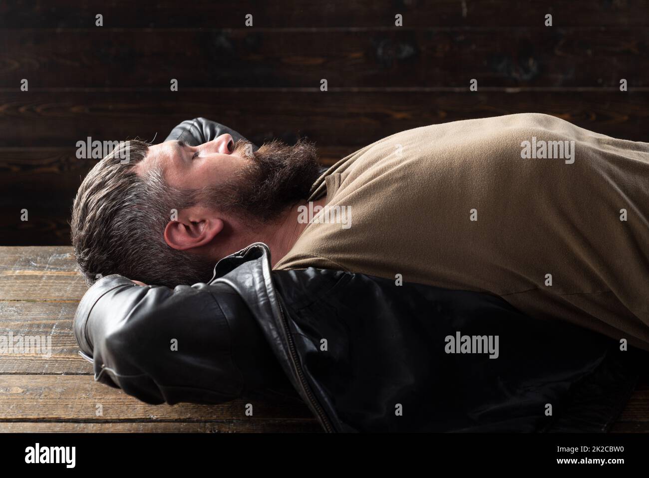 Portrait of handsome man. Bearded guy relaxing, dreaming. Stock Photo