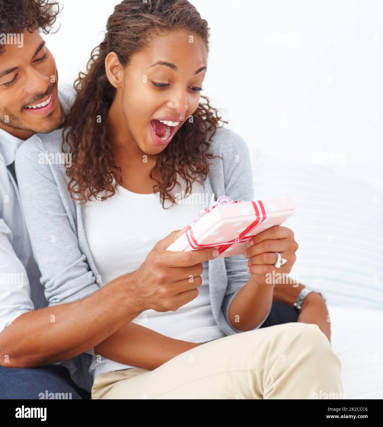 African woman receiving gift from hi res stock photography and