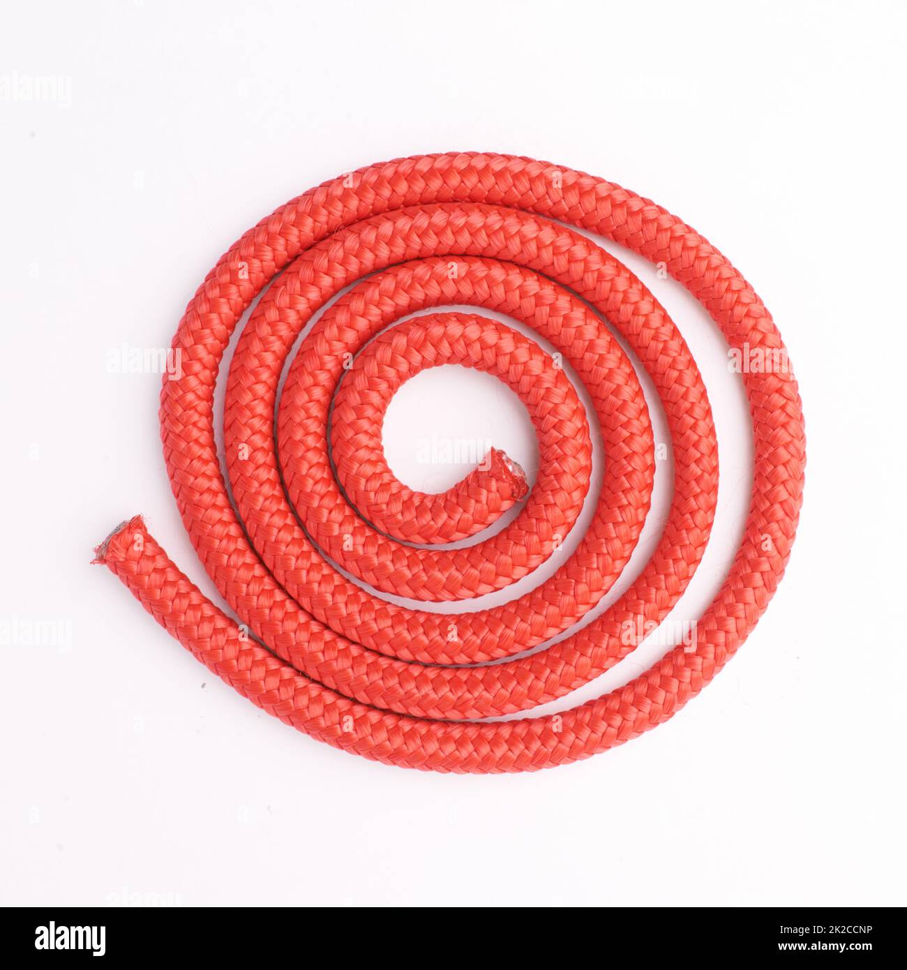 Tying things together. Studio shot of a coiled rope. Stock Photo