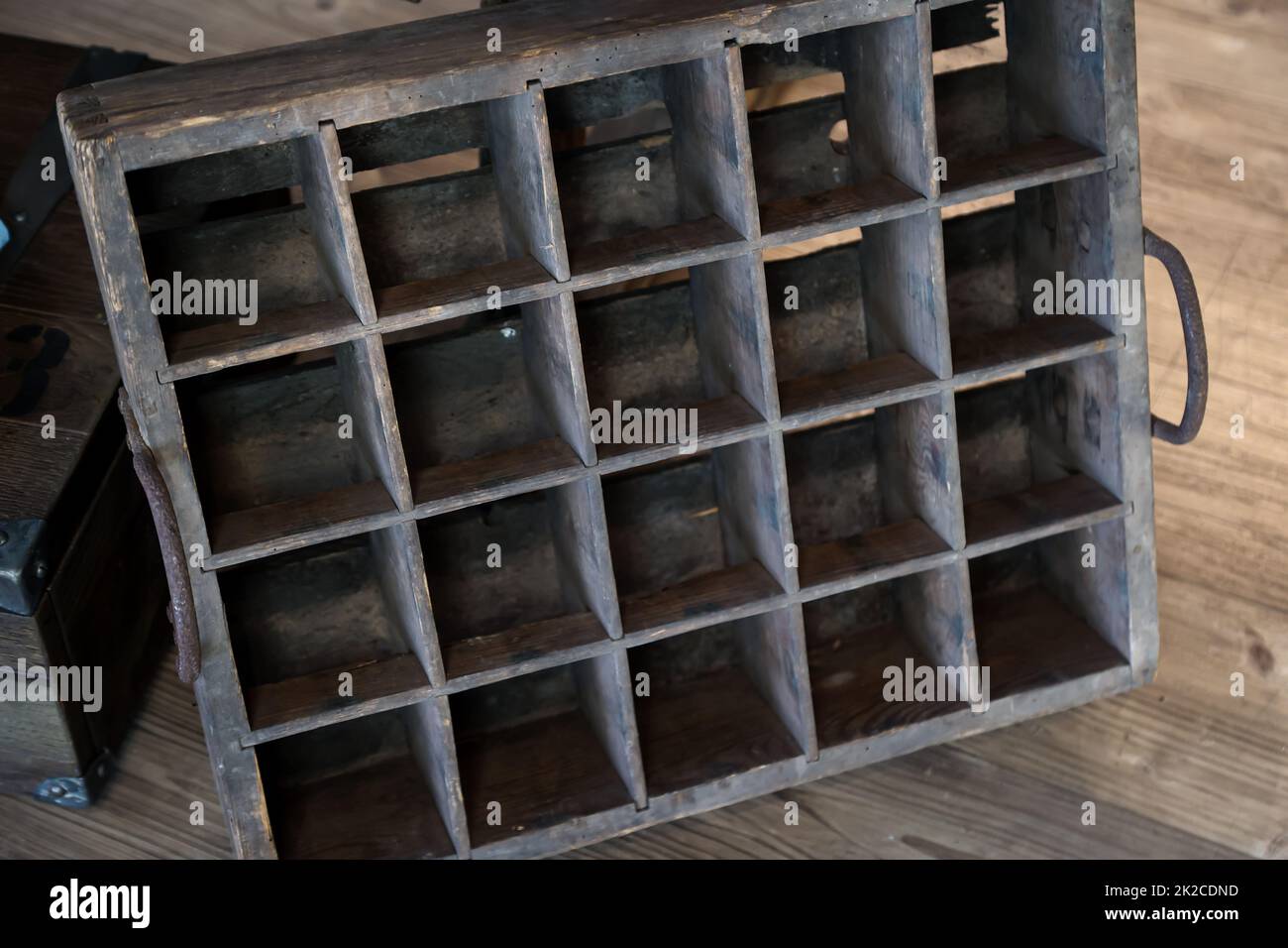 An old wooden box for beer bottles or for effervescent bottles. Stock Photo