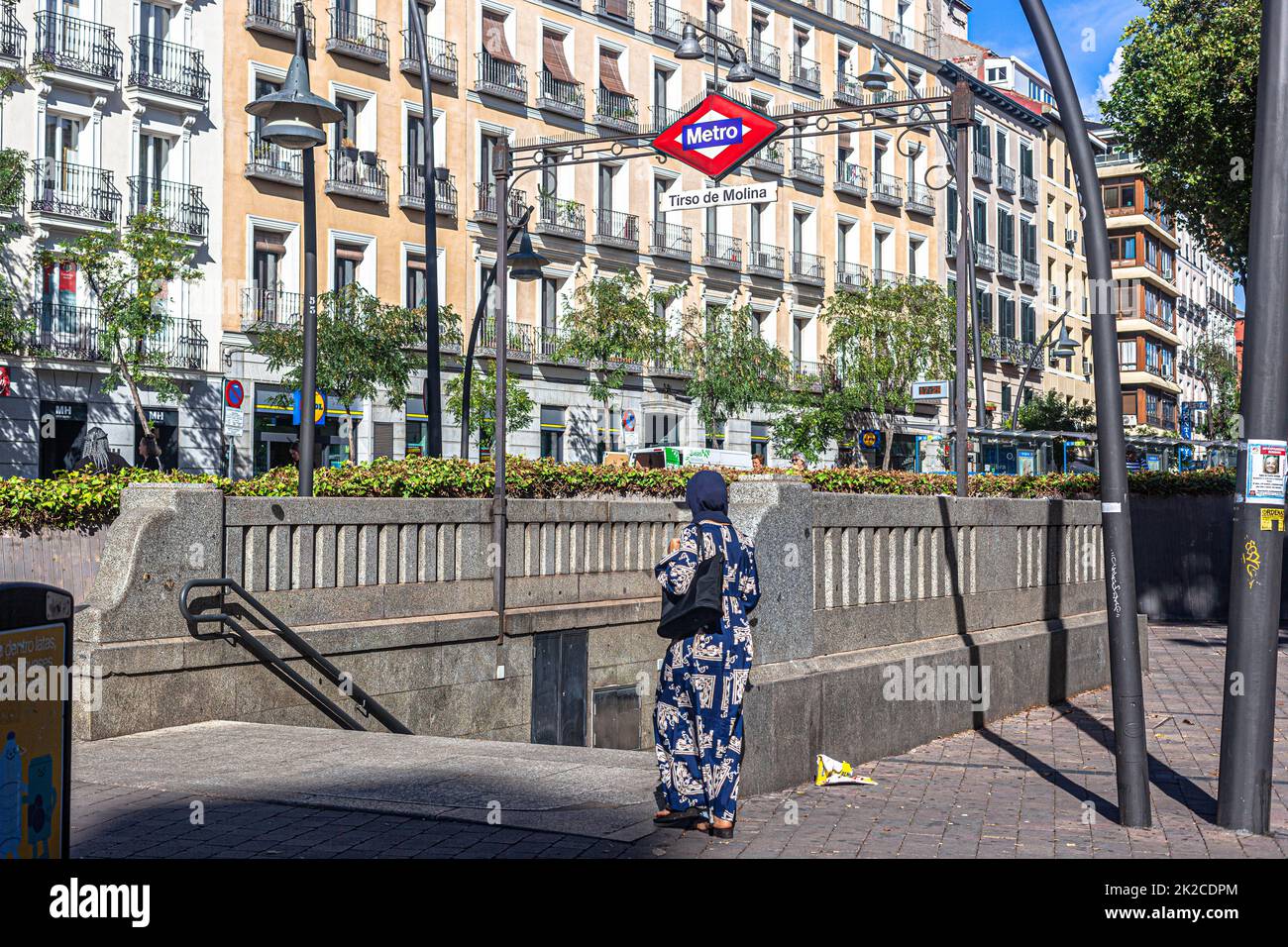 Muslim woman entering metro station Tirso de Molina, Madrid, Plaza Tirso de Molina, Madrid, Spain. Stock Photo
