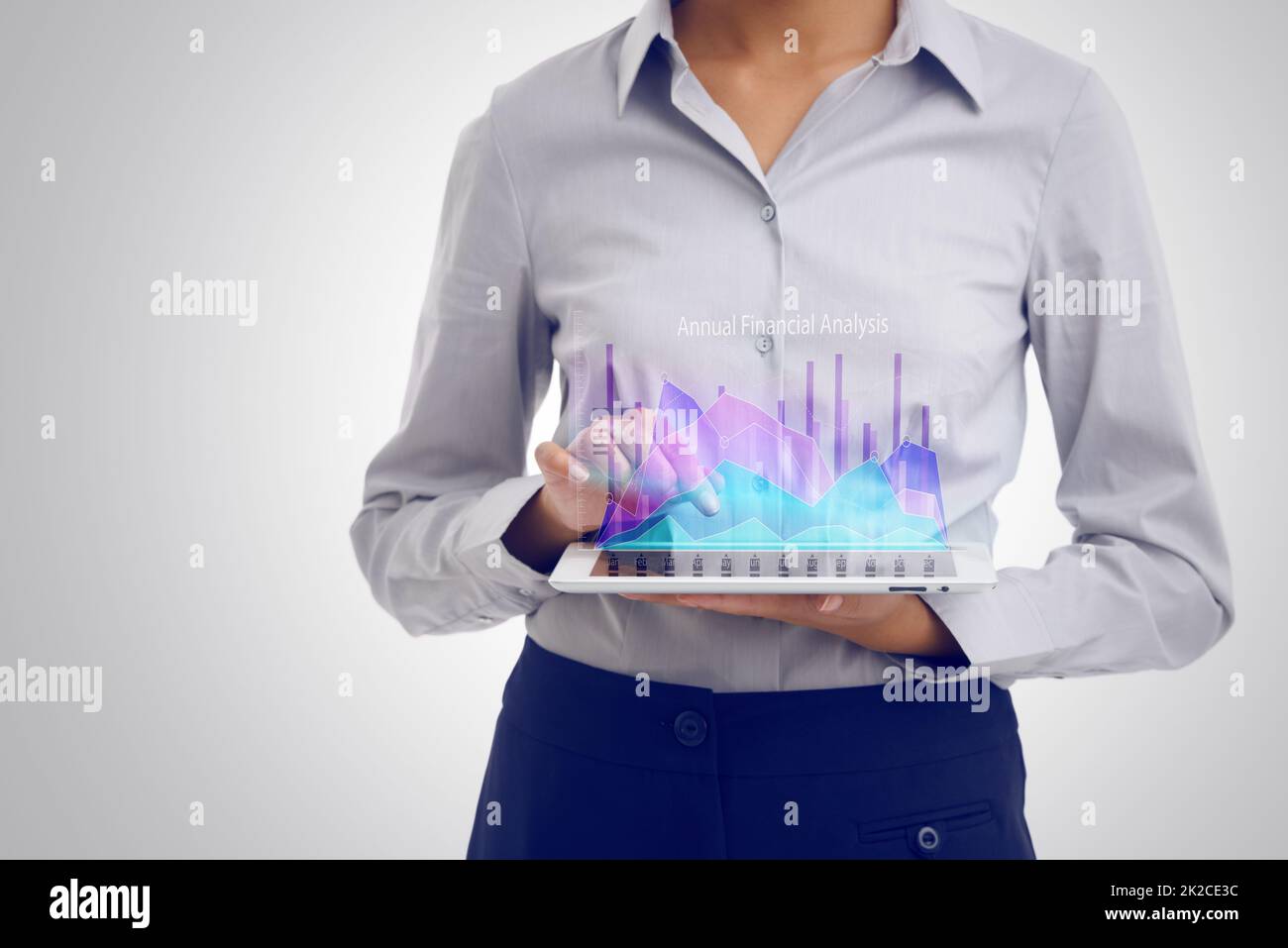 Analyzing the numbers. Cropped shot of a businesswoman using a digital tablet to analyze financial data. Stock Photo