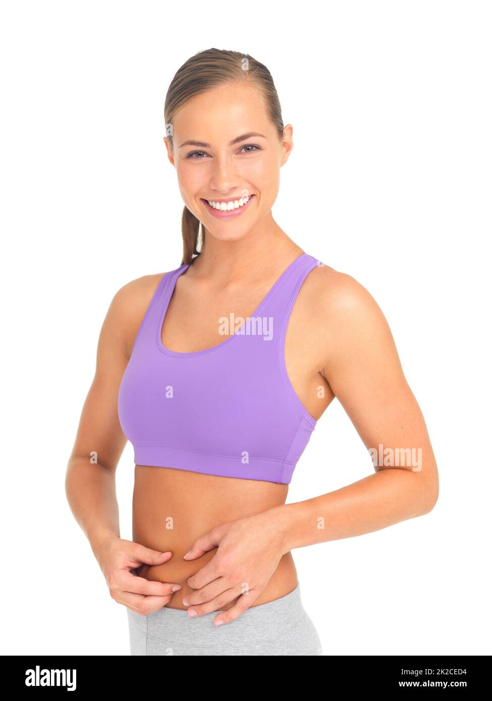 Shes positive about her healthy lifestyle. Studio portrait of a sporty young woman isolated on white. Stock Photo