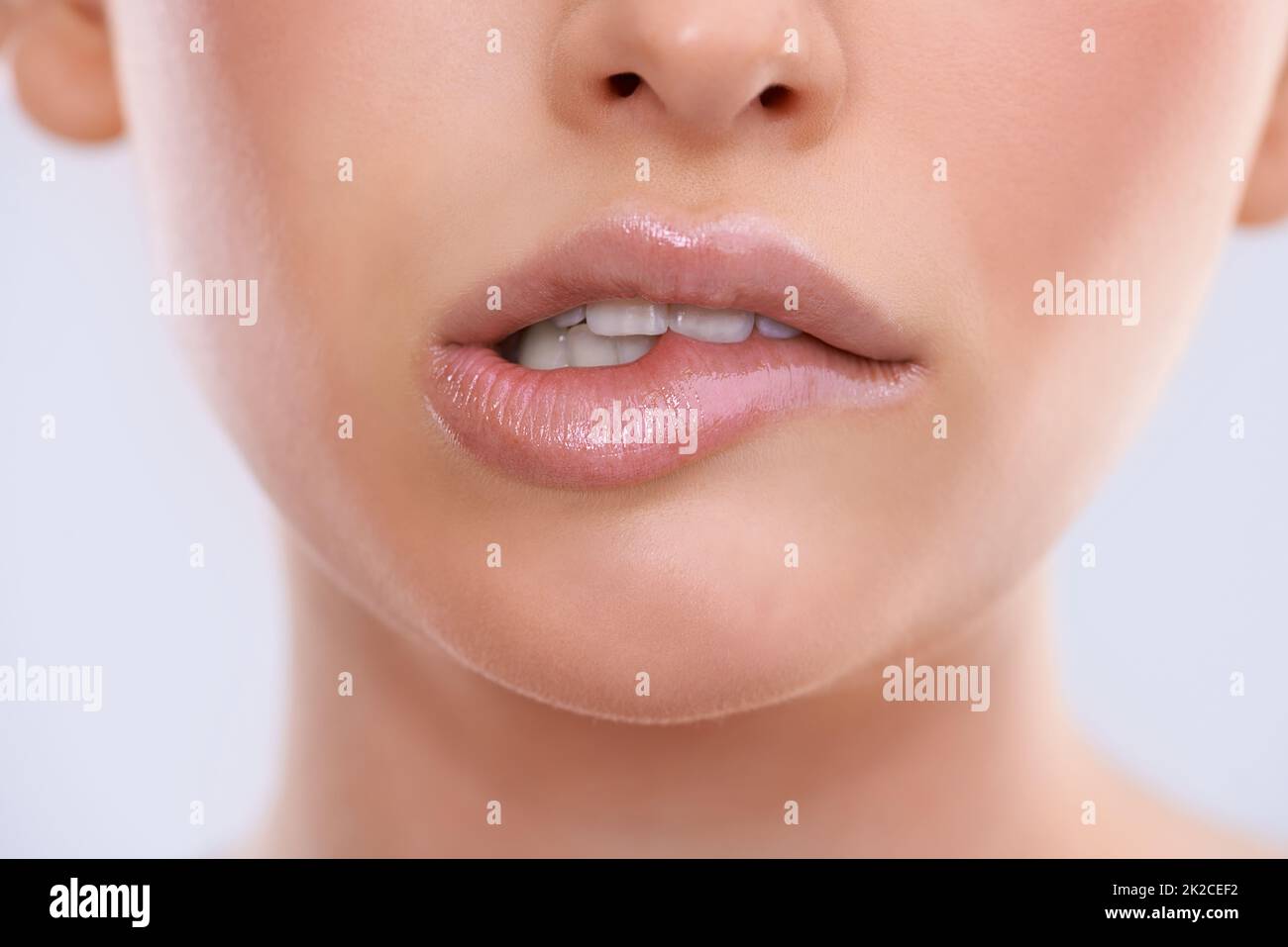 Not so sure about this.... Closeup shot of a beautiful womans mouth. Stock Photo