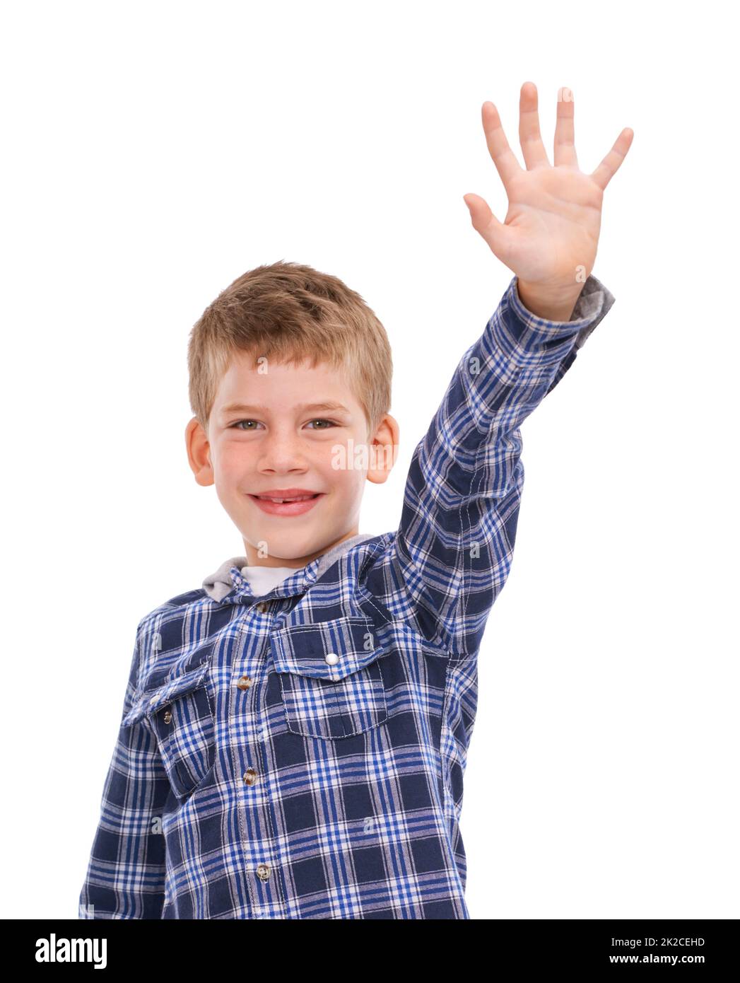 Hes gonna grow big. Studio shot of a casually dressed young boy isolated on white and holding up his hand. Stock Photo