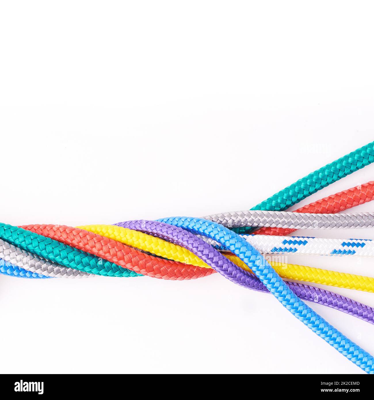 Colorful cords. Studio shot ropes knotted together isolated on white. Stock Photo