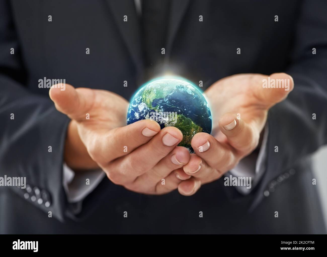 Hands holding globe hi-res stock photography and images - Alamy