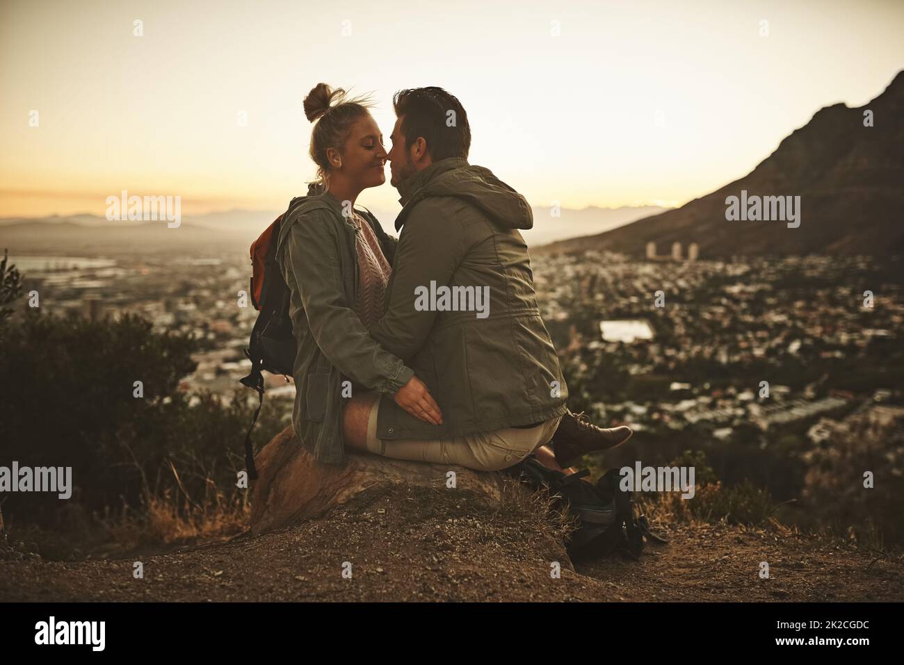 Our idea of romance is adventure. Cropped shot of an affectionate couple on a mountain top. Stock Photo