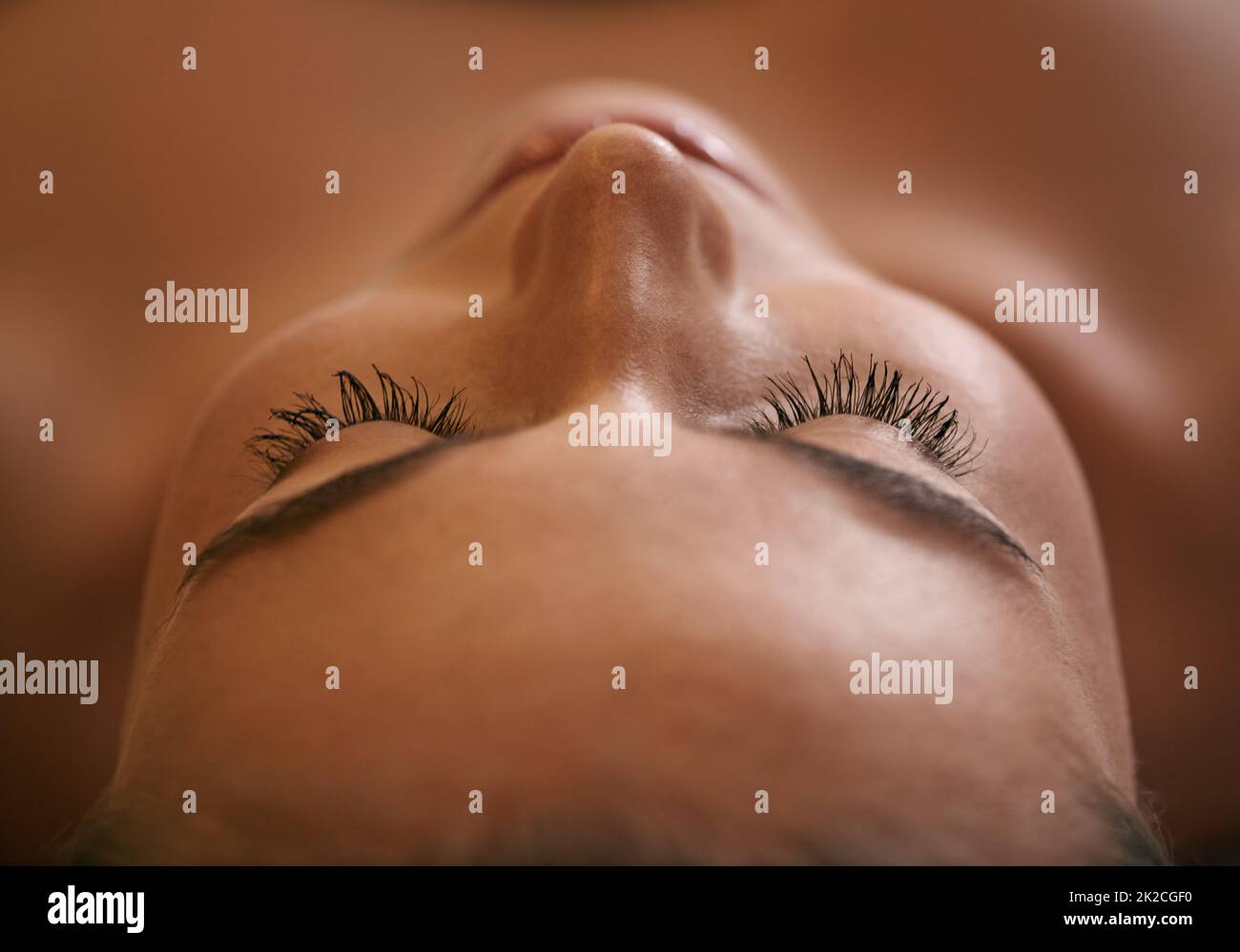 Total relaxation. Closeup of a young womans face during a massage. Stock Photo