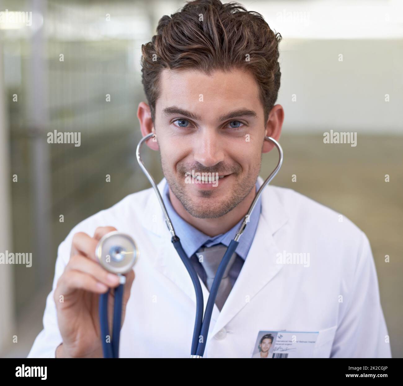 Handsome young doctor hi-res stock photography and images - Alamy