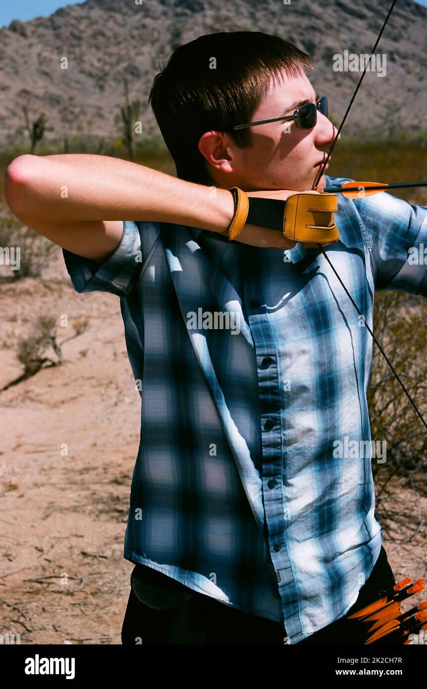 The Traditional Archer shooting in the desert Stock Photo Alamy