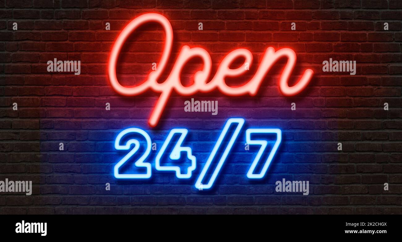 Neon sign on a brick wall - Open 24 7 Stock Photo