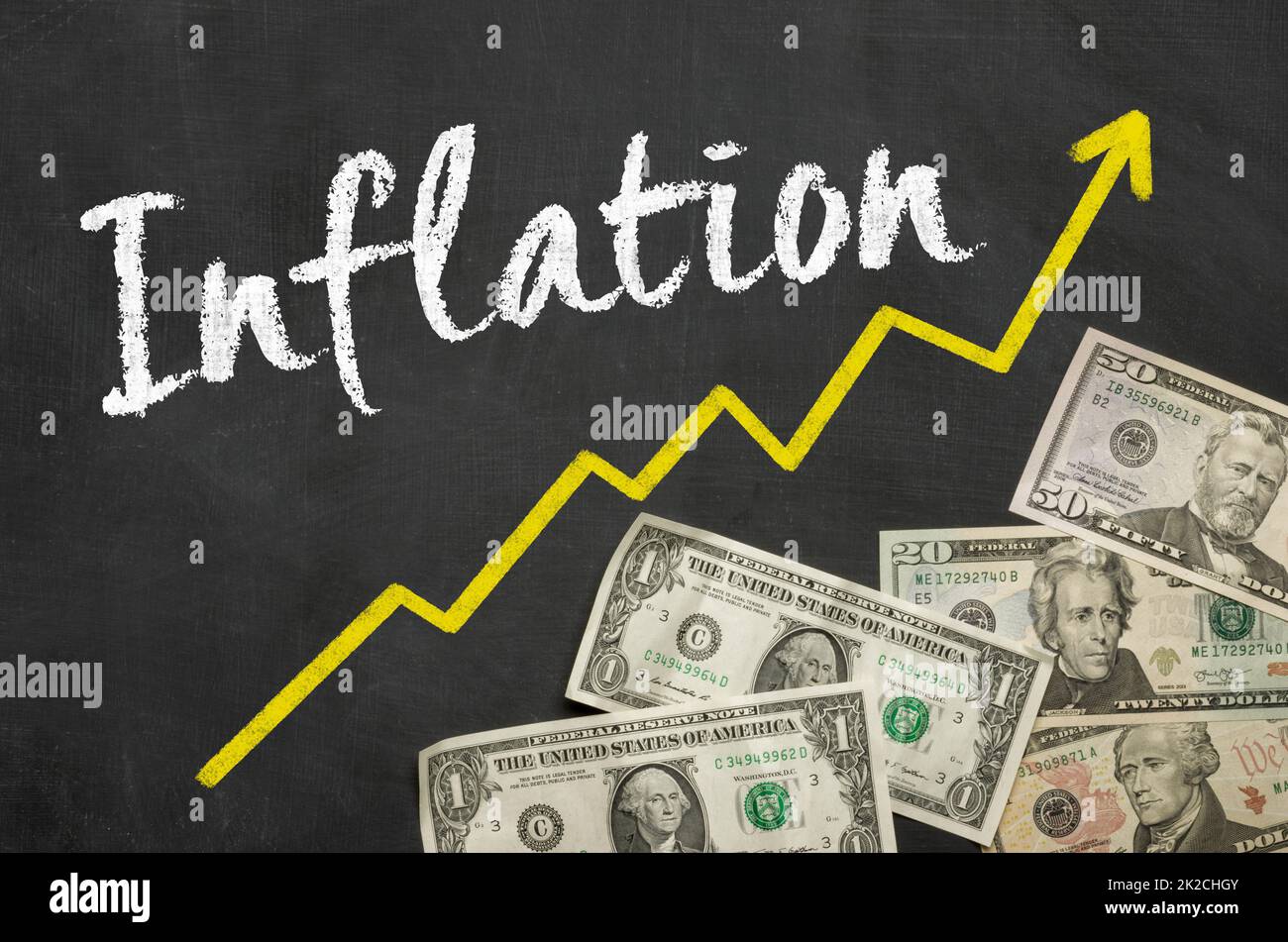 Text on blackboard with Dollars - Inflation Stock Photo