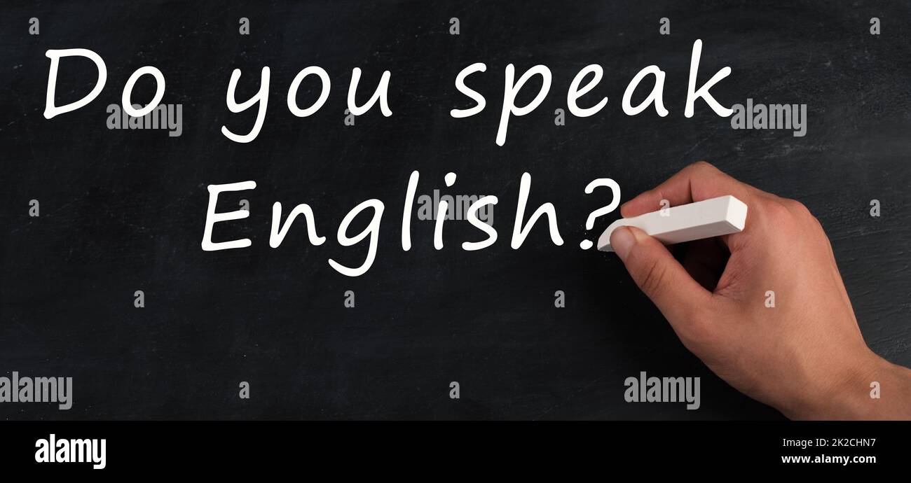 Do you speak english is standing on a chalkboard, language learning for school and work Stock Photo