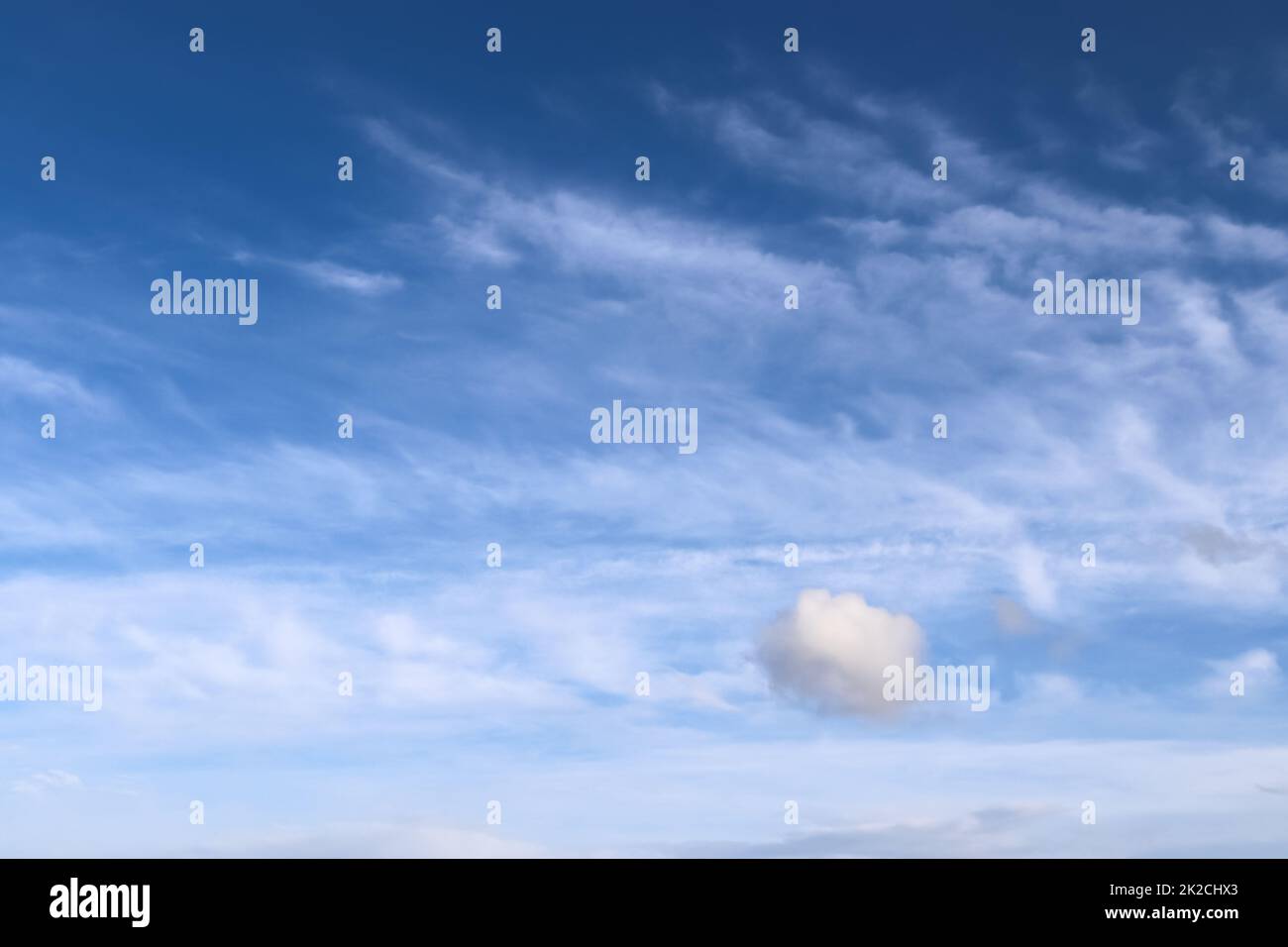 Stunning cirrus cloud formation panorama in a deep blue sky Stock Photo ...