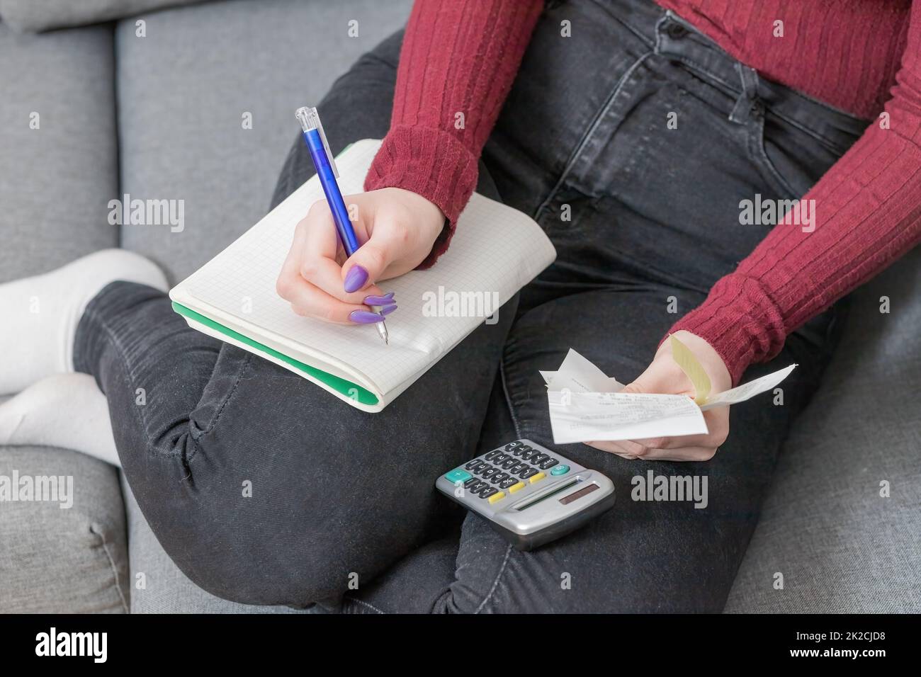 Home bills concept. Young woman calculating bills. Stock Photo