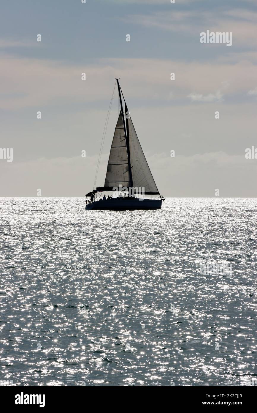 Segelschiff im Gegenlicht - Symbolbild fÃ¼r Freiheit und Fernweh Stock Photo