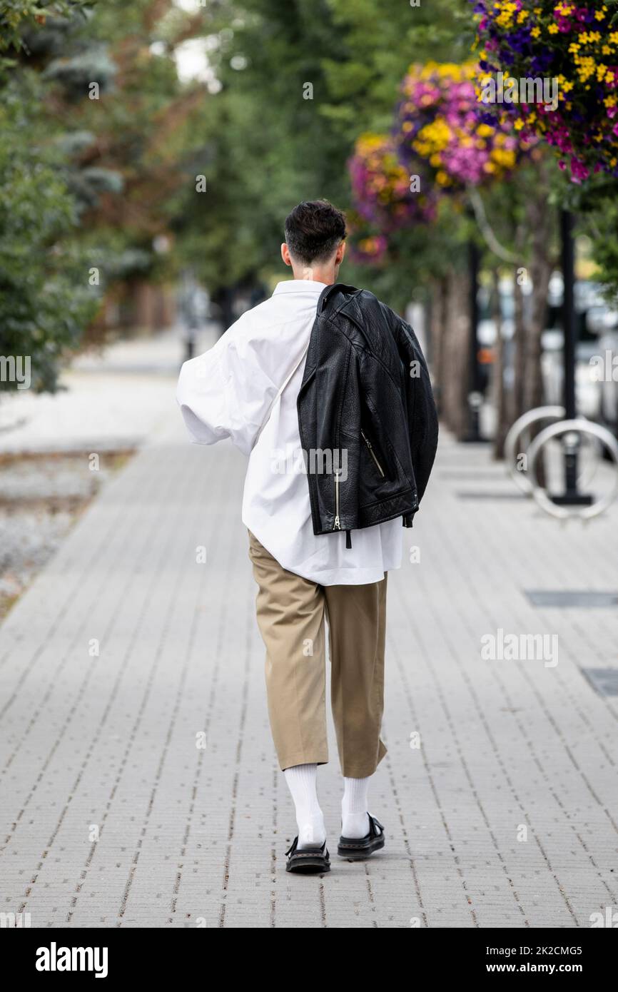 Young man walking on white hi-res stock photography and images - Alamy