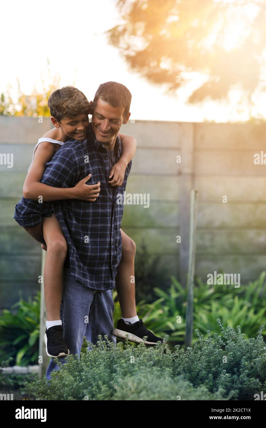 Dad giving son piggyback ride hi-res stock photography and images - Alamy