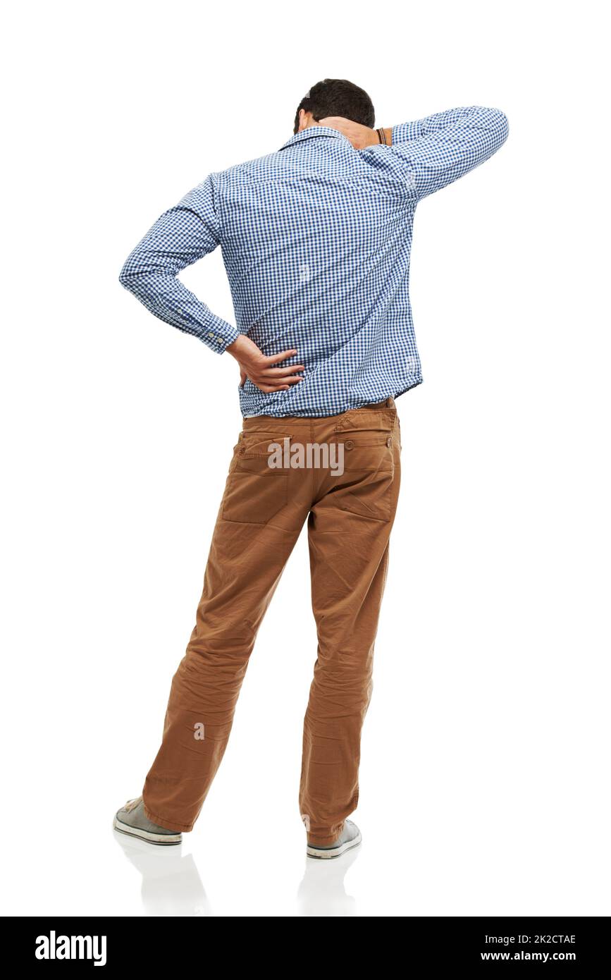 Hes got a sore back from sitting all day. Rearview of a young man