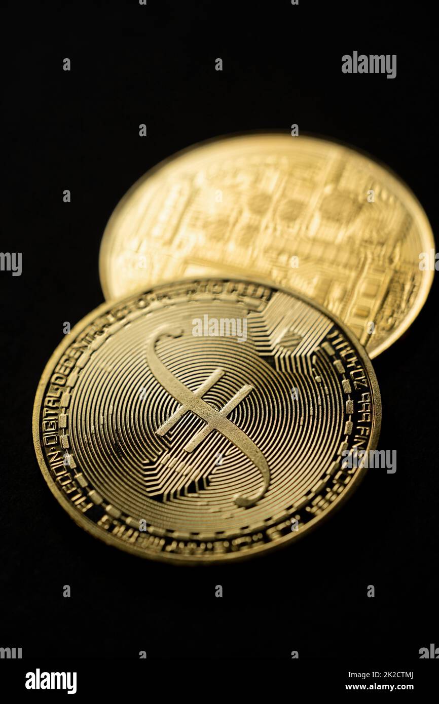 Close up shot of a golden Filecoin digital cryptocurrency. Stock Photo