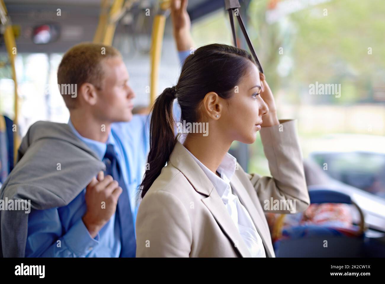 This is their daily commute to work. Shot of young business people commuting to work. Stock Photo