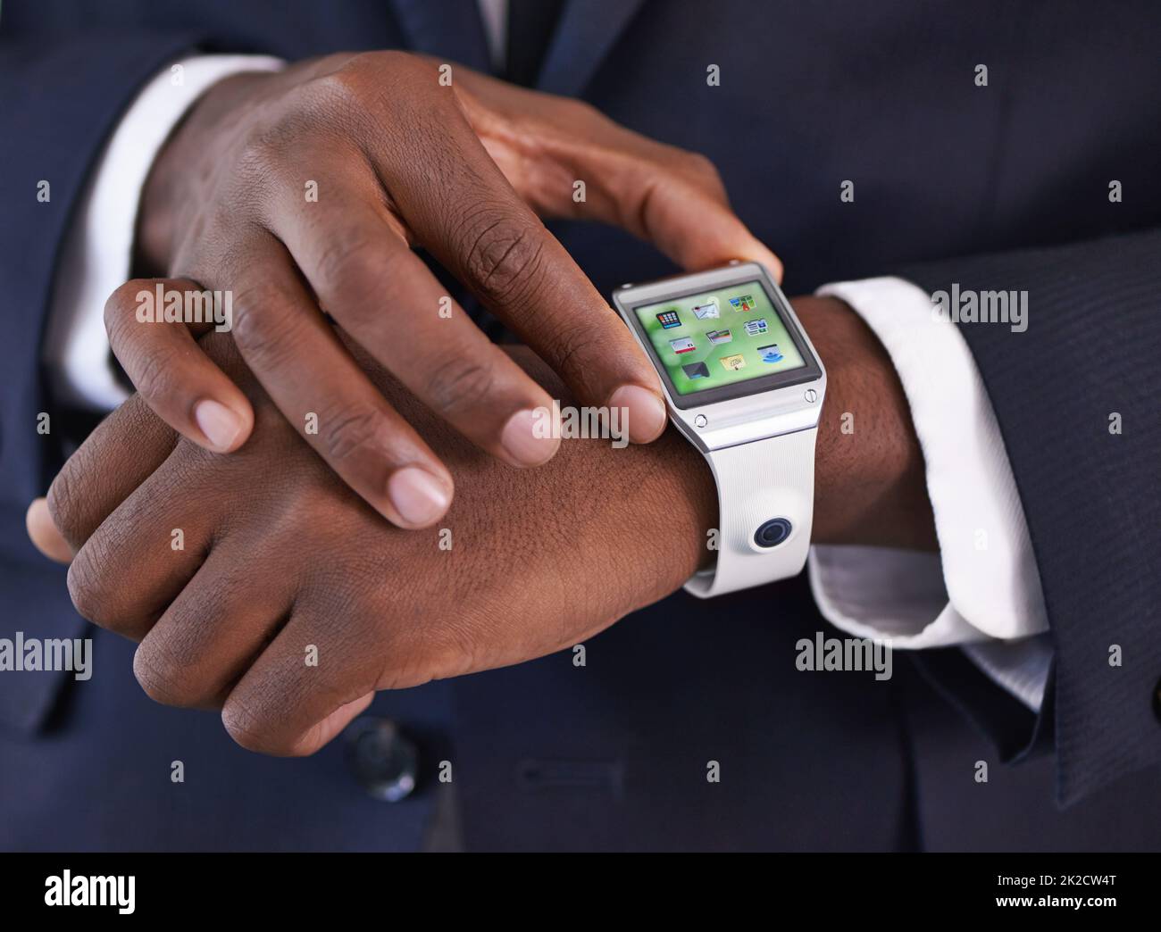 Setting the time. Cropped view of a young businessman wearing a