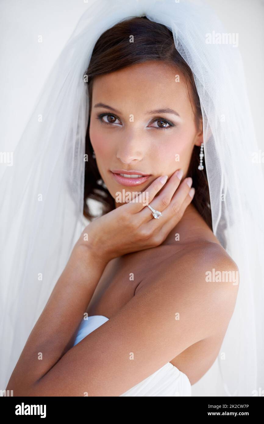 Bridal beauty. A gorgeous young bride looking at the camera. Stock Photo