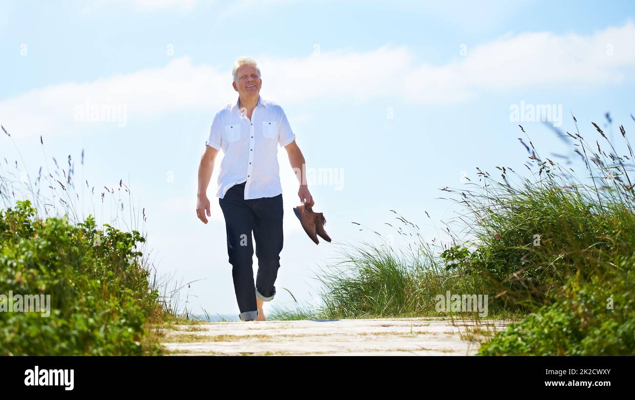 Senior man walking outside hi-res stock photography and images - Alamy